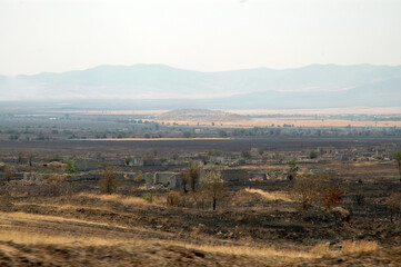 Deserted landscape with bombed houses in Nagorno Karabakh