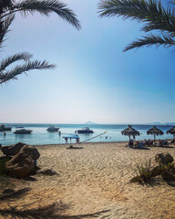 Naklejka premium La manga Espana beach with palm trees, sunny beach, view of Spain