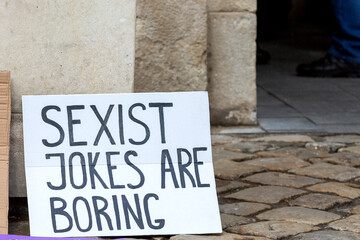 A feminist march and rally on March 8th for International Women's Day. A poster with the...