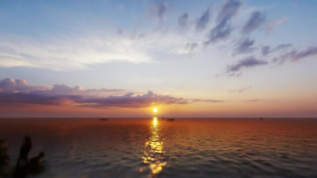 Refugees On Small Boats Sailing Over Sea Against Beautifull Sunset