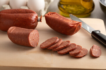 Slices of traditional Turkish halal sucuk, a dry, spicy and fermented sausage close up   