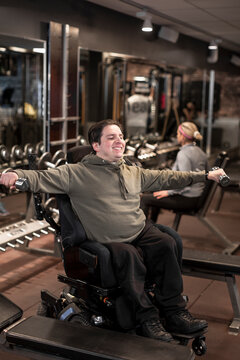Man on wheelchair training in gym