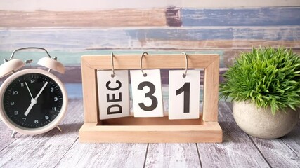 wooden calendar set on the 31 of December.