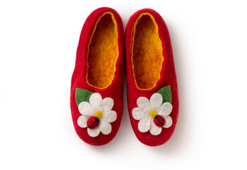 Felt slippers on white background in closeup