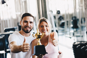 Healthy man and woman  fitness exercising session in gym.