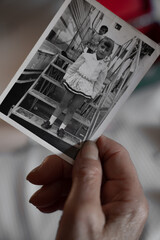 Detail of an old woman childhood photo with a dress