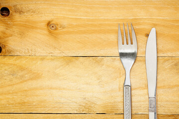 spoon and fork on wood