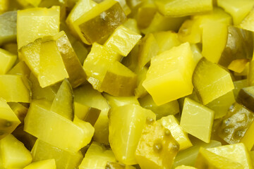 Background of diced pickles, top view, macro