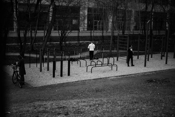 People working out outdoors, keeping distance required by sanitary rules during pandemic