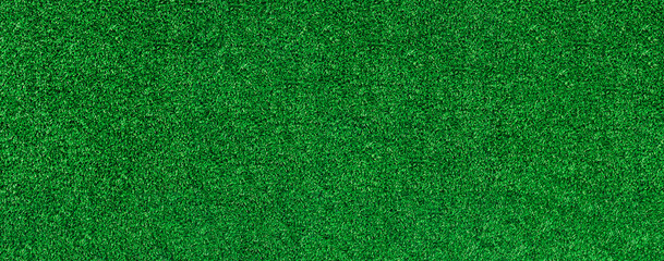Green artificial grass pattern texture background. Grass meadows on football field or golf. Top...