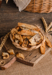 Appetizing fresh white bread croutons on wooden