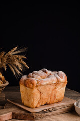 Beautiful loaf of white bread with copy space on a wooden background