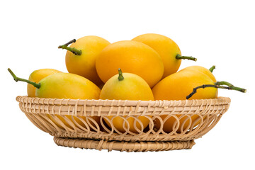 Closeup of ripe Marian Plum in bamboo basket on white background with clipping path. Delicious sweet yellow marian plum in Thailand.
