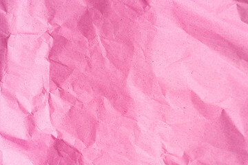 Crumpled pink paper texture. Trendy pink or rose color and surface for text and design
