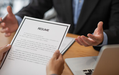 Employer or selection committee is reading the candidate's resume and competence background,...