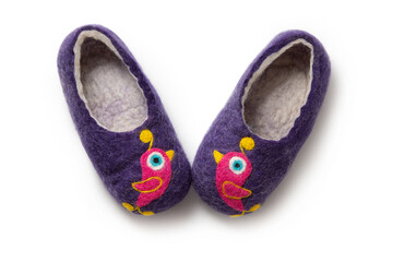 Felt slippers on white background in closeup