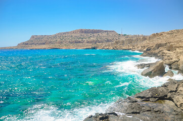 Fototapeta premium Seascape, sea waves break on the rocks, Cyprus, Cape Kavo Greko