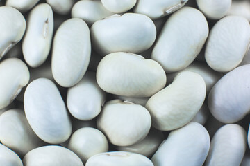 White kidney beans background texture. Vegan and vegetarian photo. Ecological green food. Close up, macro photo.