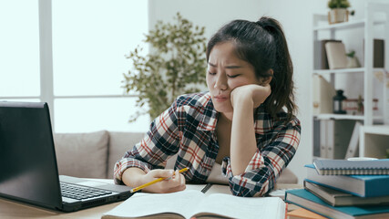 chienese woman feeling studying is tedious
