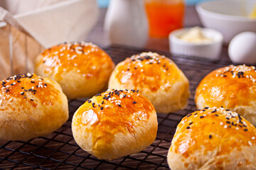 Fresh homemade whole grain burger buns with sesame