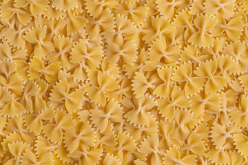 Farfalle pasta background. Top view macaroni. Copy-space