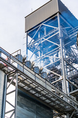 Naklejka premium HIgh steel structure at granary. Special construction built near tanks with wheat. Closeup.