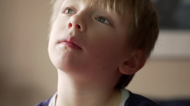 Portrait of a cute little boy shaking his head.