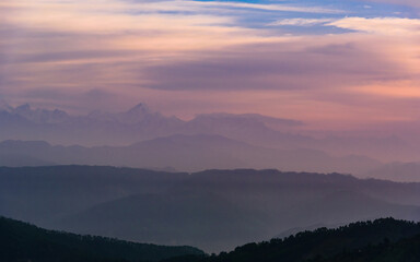 Naklejka na ściany i meble Panoramic landscape of great Himalayas mountain range during an autumn morning from Kausani also known as 'Switzerland of India' a hill station in Bageshwar district, Uttarakhand, India.