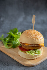 Hamburger, burger, steak, tomato, sauce and lettuce tasty meat snack sandwich menu concept. food background. front view. copy space