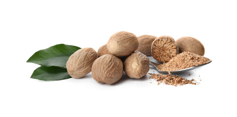 Grated nutmeg and seeds with green leaves on white background