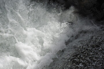 White water splashing off the rocks in Big Pine Creek, in the Eastern Sierra Nevada Mountains, Inyo County, California.
