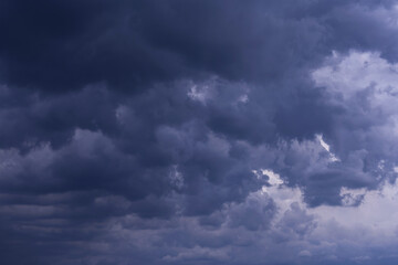 Epic Dramatic Storm sky with dark blue violet cumulus rainy clouds background texture, thunderstorm
