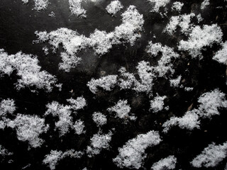 large white snowflakes on a dark background