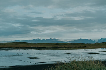 Glacier reflected on the water. View from Stokksnes. East Iceland landscape