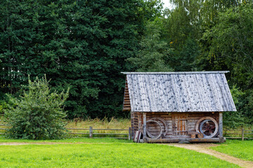 Barn on the background of the forest.