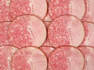 Slices of salami  background. sausage cut. uncooked smoked. two-component sausage