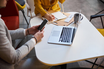 Close up of busy people being at work