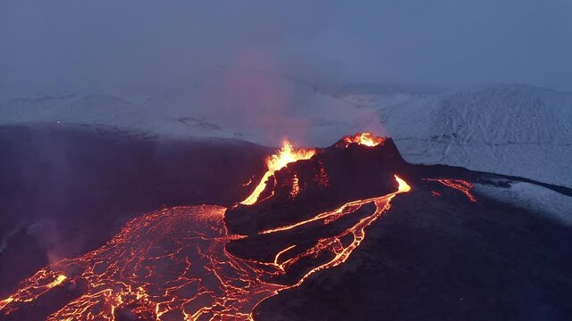 Fiery Molten Lava River Flowing From Craters During Blue Hour At Fagradalsfjall Volcano Eruption, Reykjanes Peninsula, South Iceland. - Aerial Drone Shot
