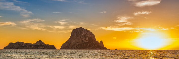 The island of Es Vedra from an Ibiza beach at sunset