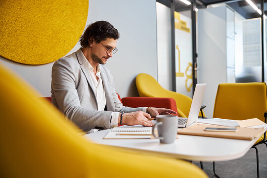 Concentrated businessman working at conception of his office