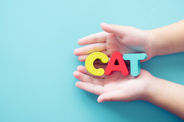Cat word on kid hand.Cat lover owner care and love.Animal and people.veteran day.Pet clinic health care.Canine.breed, kitten, domestic cat, Animal friendship. veterinarian.pedigreed.pet care.