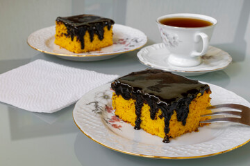 Carrot cake with chocolate icing for afternoon snack. 