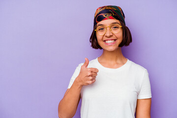 Young mixed race woman wearing a bandana isolated on purple background smiling and raising thumb up