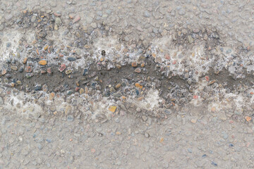 Horizontal wet groove on a concrete surface. Isolation of white salt.