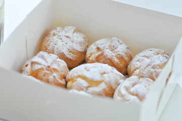 choux cream or cream puff, eclair in the box