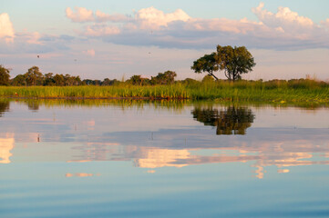 sunset over lake in okavango delta