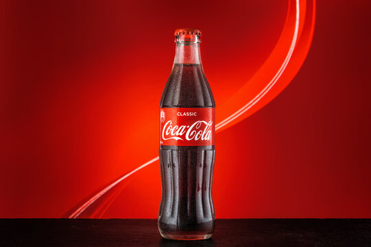 MOSCOW, RUSSIA - May 5, 2020: Classic bottle Of Coca-Cola on the bright colored background.