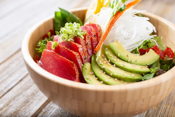A view of a tuna and avocado salad bowl.