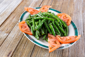 A view of a plate of steamed long beans.