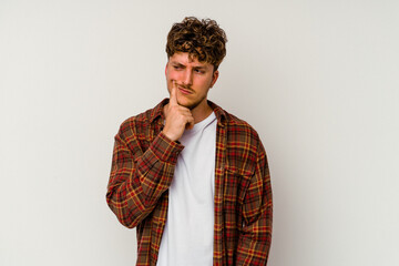 Young caucasian man isolated on white background contemplating, planning a strategy, thinking about the way of a business.